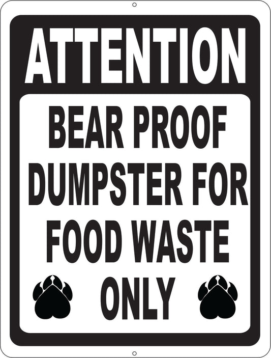 A rectangular warning sign with a black border and white background. The sign reads 'ATTENTION BEAR PROOF DUMPSTER FOR FOOD WASTE ONLY' in bold black and white lettering, with two black bear paw prints near the bottom corners.