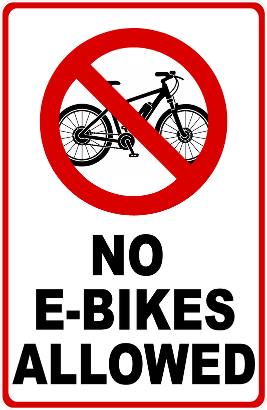 A rectangular white sign with a red border, featuring a red prohibition symbol over a black bicycle illustration and the text 'NO E-BIKES ALLOWED' in bold black letters.